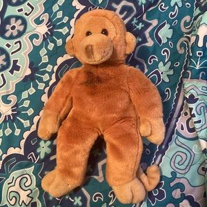 It's a cute monkey stuffed animal.